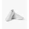 White Leather Low-Top Sneakers — IT Blacksmiths (Minimal white leather sneakers with perforated toe box and vulcanised rubber sole. A clean foundation for everyday streetwear.)